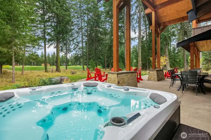 Hot Tub on back patio near primary bedroom