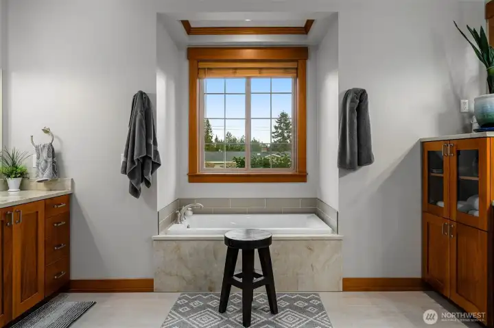 Large primary bathroom offering a peaceful spa-like setting.