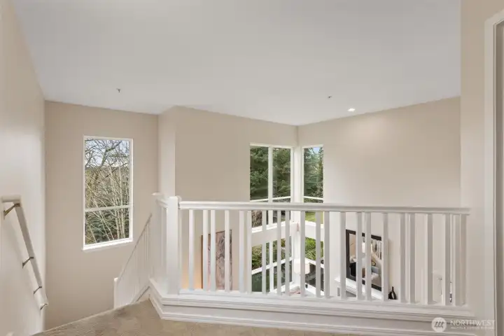 Spacious and open hallway provides great view of living space on main.