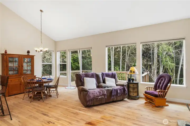 Great room with attractive hardwood Flooring and large windows to take in the great outdoors