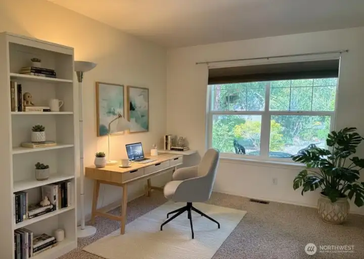 Office/den/flex space on the main level with garden window - virtually staged.