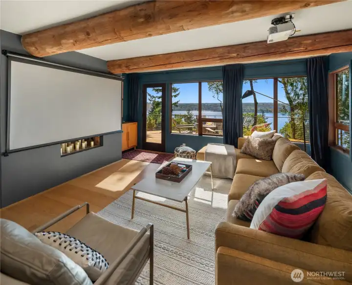 A screen, projector and blackout curtains for movie nights. A screen, projector and blackout curtains for movie nights.