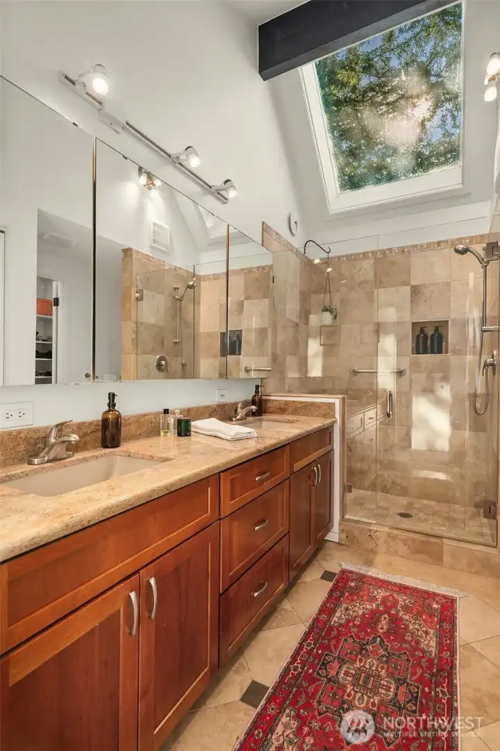 The skylit primary bath with double sinks The skylit primary bath with double sinks