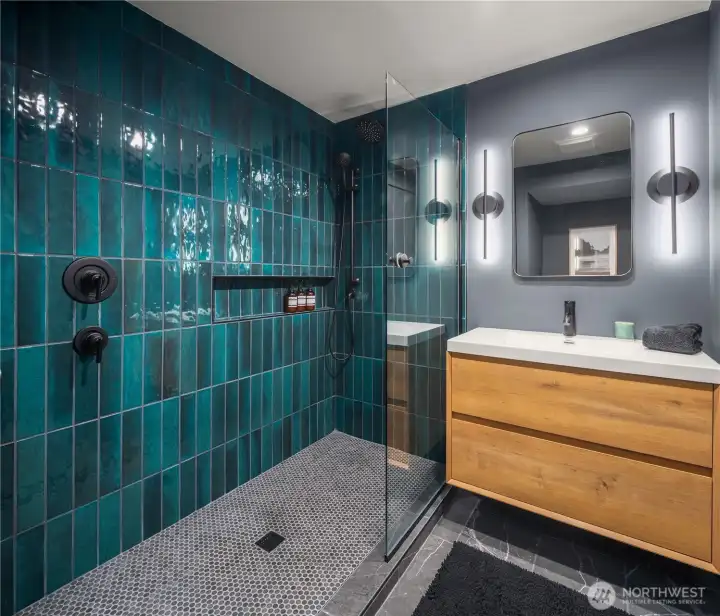 The new bathroom serving the guest / 2nd primary suite. The new bathroom serving the guest / 2nd primary suite.