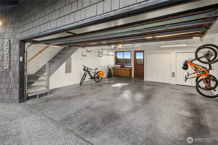 Large 2-car garage with extra storage and direct access to the back deck. Large 2-car garage with extra storage and direct access to the back deck.