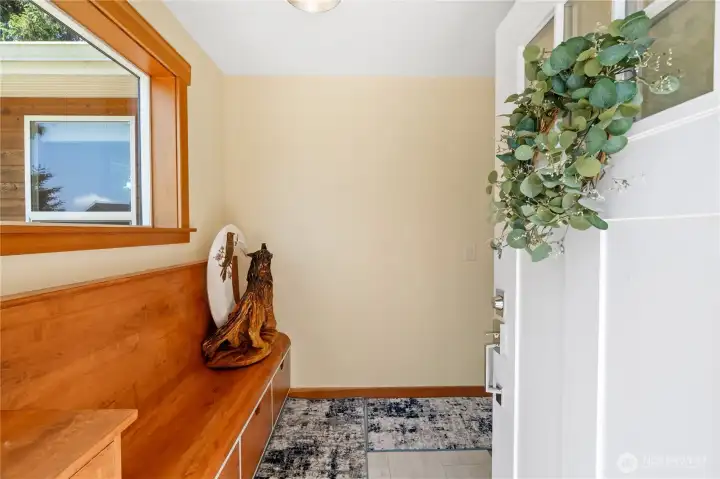 Front entrance with custom built-in with seating and drawers