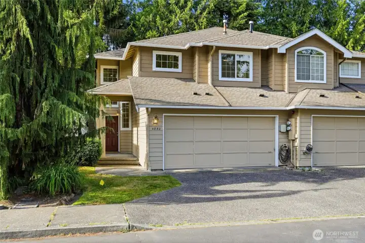 Welcome home to this updated end-unit townhome with attached two-car garage.