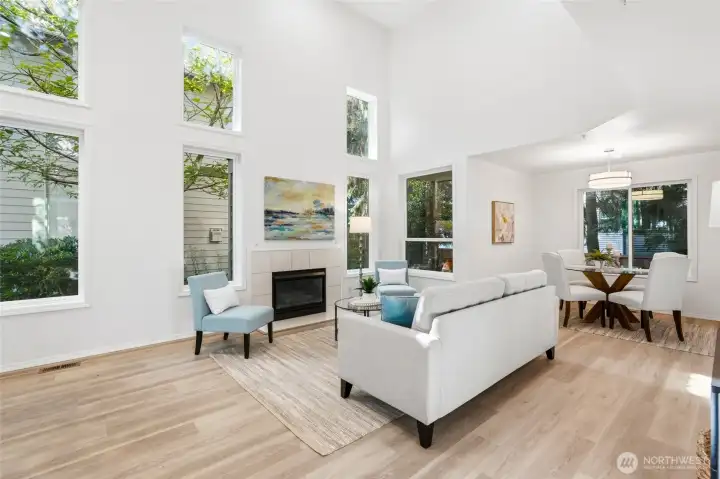 Walls of windows bring in natural light throughout the day.