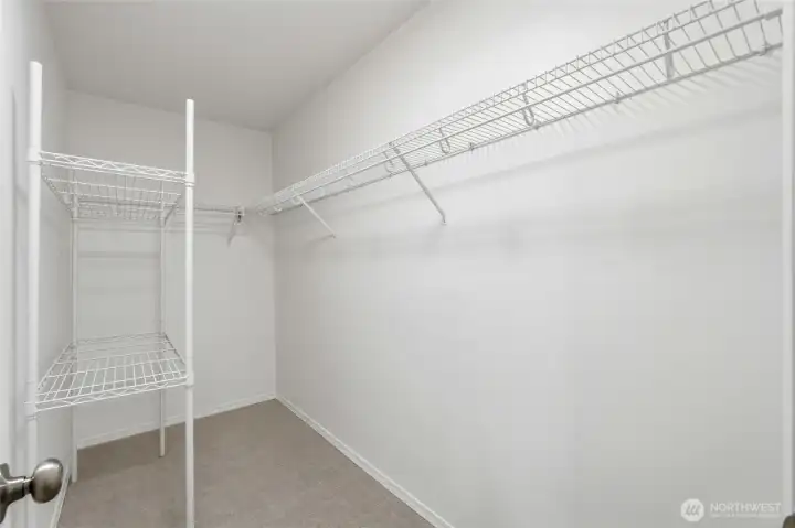 Walk-in closet provides generous storage and organization space.