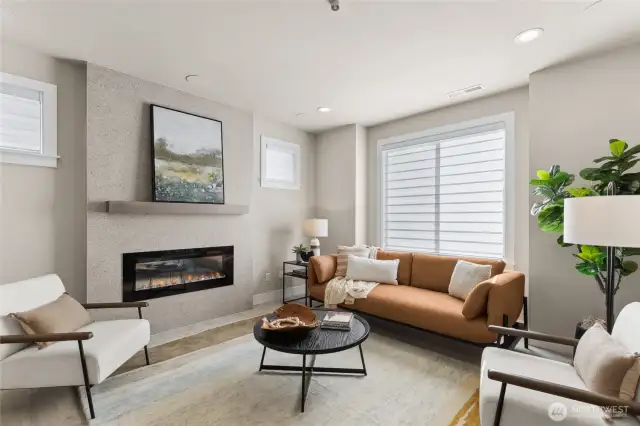 The family room has a large window and plenty of room to relax and unwind with a wall mounted T.V location, surround sound in living room ceiling and an electric fireplace for ultimate enjoyment.