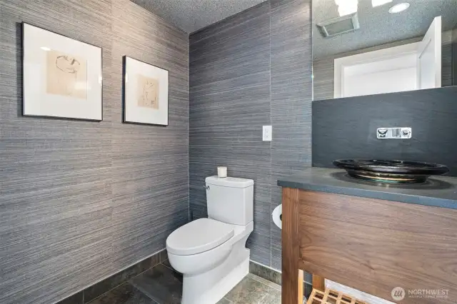 First step on the right, the powder room.