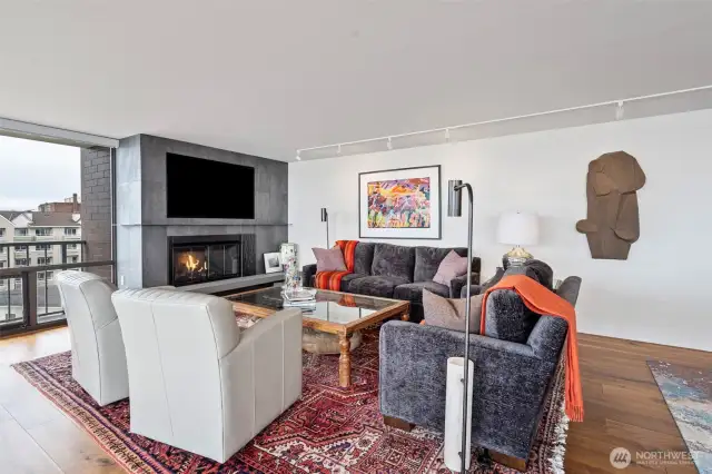 Warm up by the gas fireplace - plenty  of wall space for your art collection.
