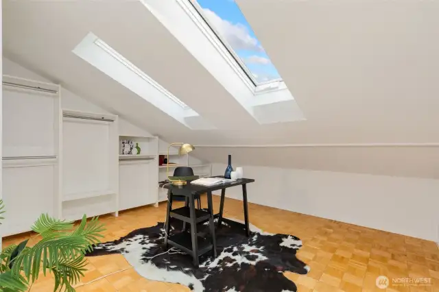 Office / flex space with newer skylights and built-in shelving