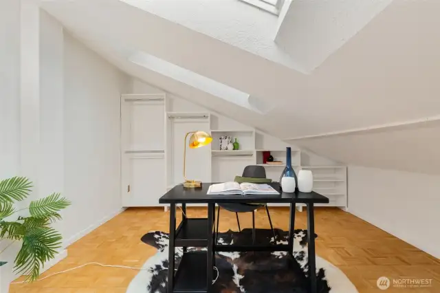 Office / flex space with newer skylights and built-in shelving