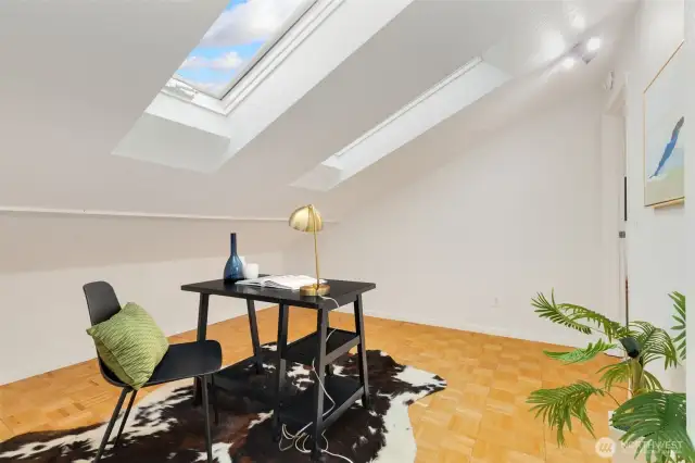 Office / flex space with newer skylights and built-in shelving