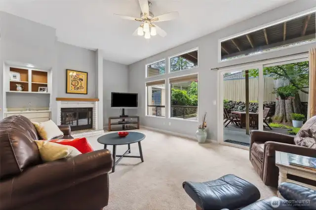 Spacious lower level living room with newer slider to private patio and yard area