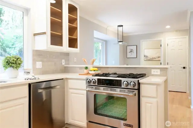 The Kitchen hosts all Stainless Steel appliances.  The Jennair gas range with convection oven and downdraft venting caters to culinary enthusiasts, while a new built-in wine fridge adds a touch of luxury and convenience.