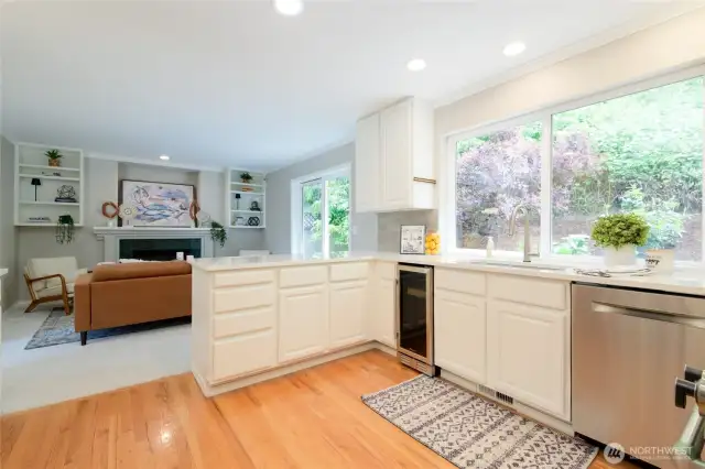 Just off the kitchen, the family room offers a comfortable, relaxed space perfect for everyday living. A cozy gas fireplace anchors the room, creating a warm and welcoming ambiance year-round.