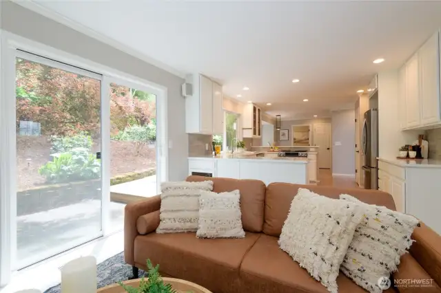 The layout flows effortlessly into adjacent living and dining areas, making it an ideal floor plan for everyday living or hosting gatherings.