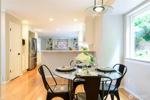 Just off the kitchen, a dedicated eating area offers the perfect spot for casual meals and morning coffee. Positioned next to the breakfast bar, it creates a seamless flow between cooking and dining. The kitchen pantry features convenient pull out drawers.