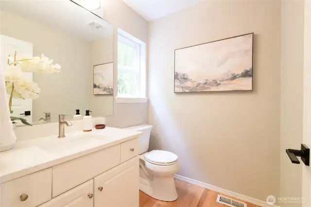 The main floor features a spacious half bath, perfect for guests and everyday use.