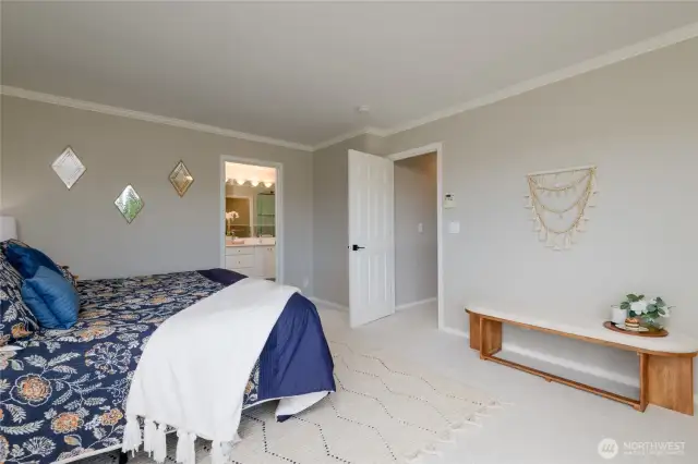 From the primary bedroom step into the spa-like en suite bathroom.