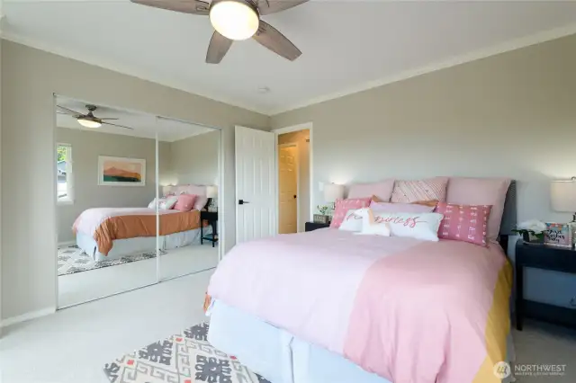 Spacious Bedroom #2 shown here with a Queen Bed has mirrored closet doors and a remote controlled ceiling fan. You'll love the soft, plush carpet underfoot!