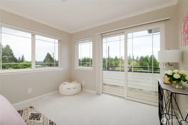 Bedroom #2 with fabulous natural light and a private balcony.