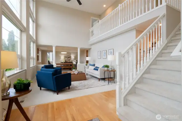 Step into the heart of the home, where soaring 20-foot ceilings and dramatic floor-to-ceiling windows create a breathtaking sense of space and grandeur. Bathed in natural light throughout the day, the open-concept living area is both striking and serene—designed to elevate everyday living while embracing the surrounding beauty.
