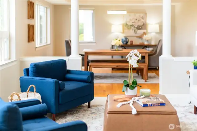 Architectural lines, warm oak hardwood floors, and thoughtfully curated finishes all add to the timeless elegance of the room, while automated Hunter Douglas remote blinds offer instant light control to match the mood.