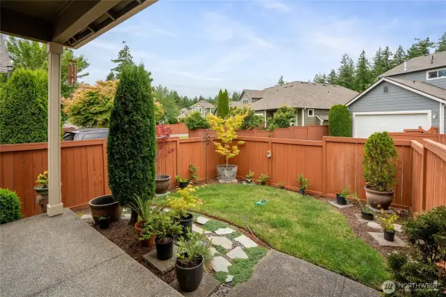 Backyard is fully fenced with a covered porch/deck area as well.