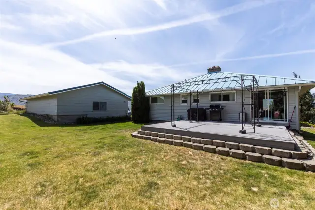Back of home, deck and garage