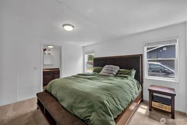 Primary bedroom with King sized bed in it.