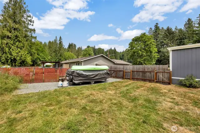 Ample parking for boat or camper behind double gate fence