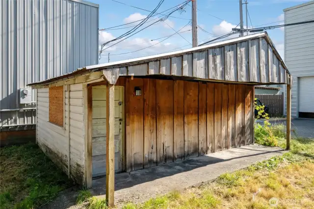 A nice size garage or storage near the alley.  Needs some updating but take a look at the possibilities.