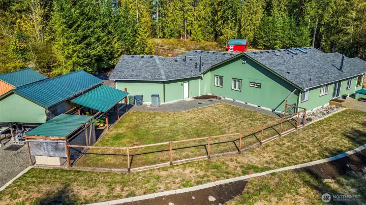 There is a fully fenced, level, back yard area. Along with a dog run in the covered area to the left.