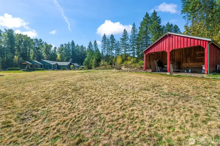 The barn / stable is approximately 20' x 20' total. The open section for the animals in the front is about 20' wide by 11'6" deep. There is an enclosed area in the back for hay, a tack room or storage.