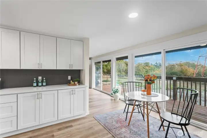 Buffet area from kitchen with dining room & view of rear yard.