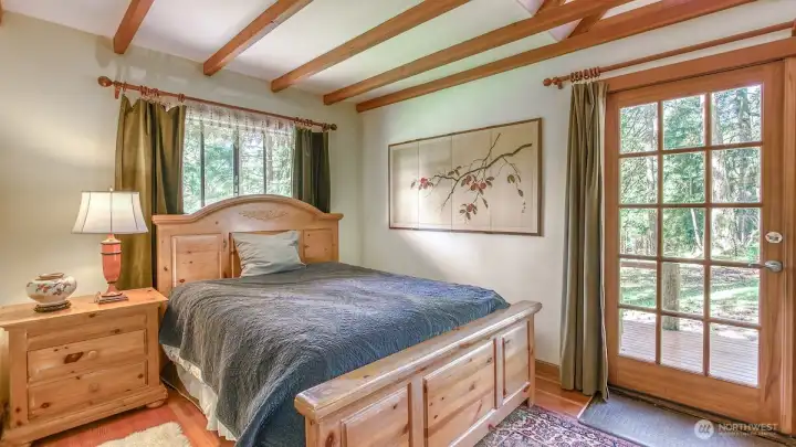 Primary bedroom with direct access to the yard.