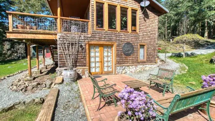 The lower level French doors provide access to to the third bedroom and laundry room.