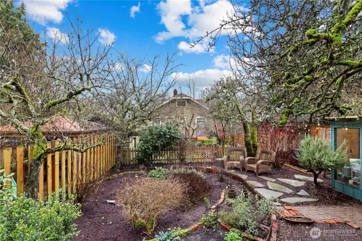 Rain-garden already in place with a shed...fruit trees, blueberries, what else could you grow?  LOOK CLOSELY - there's a hot tub over in the corner!