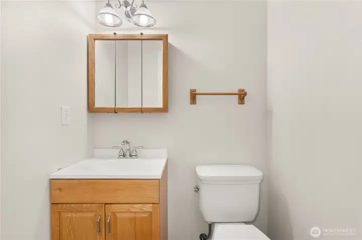 Half bath by laundry rooom.