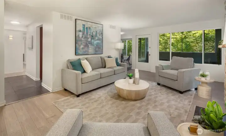 Living room with large windows allowing natural light to fill the space.