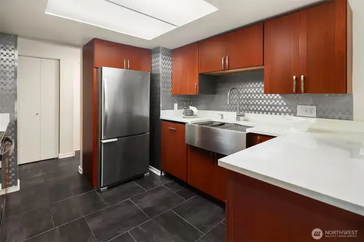 Updated and spacious kitchen with stainless appliances.