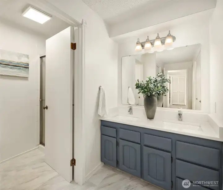 Updated, ensuite bathroom with heated floors and double vanity.