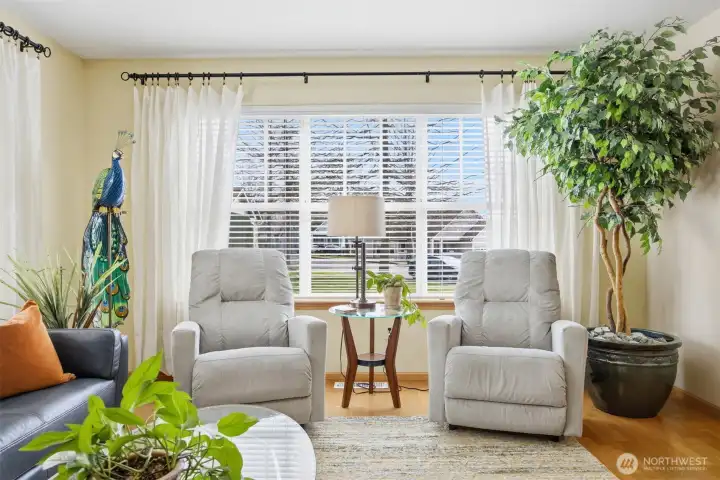 The living room is very spacious and has a large easterly facing picture window that looks out to the front lawn and the sunrises beyond.