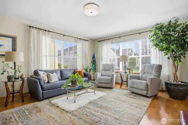 Another view showing the large living room with the gorgeous oak floors.