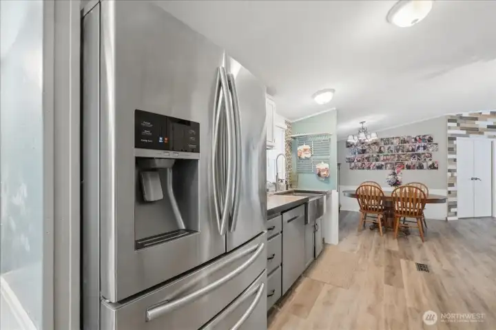 Looking from the kitchen towards the dining room. Refrigerator will convey.