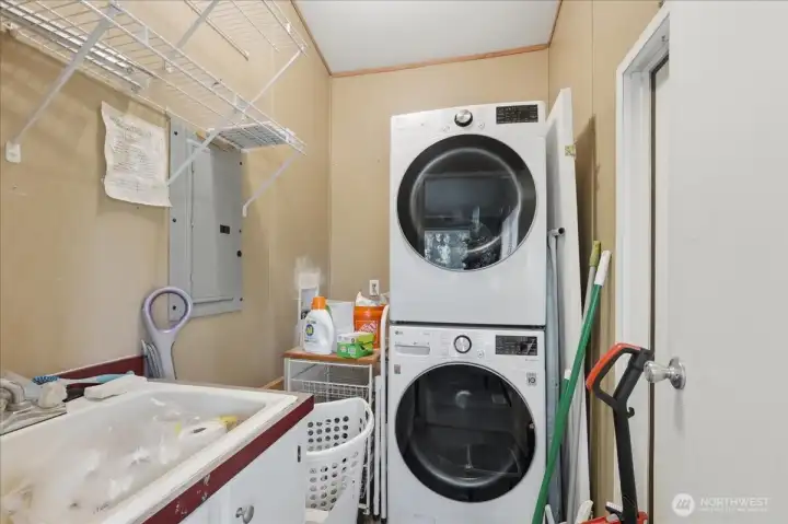 Utility/mud room with utility sink and back door entry from back yard. (Washer and dryer do not convey.)