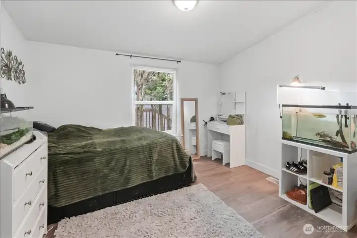 Den/office with double door entry is currently being used as a bedroom.